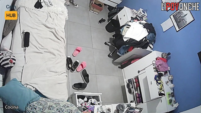 Skinny sexy girl standing topless in her bedroom