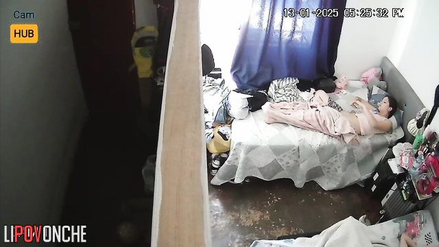 Sexy brunette taking photo of her wet pussy on the bed