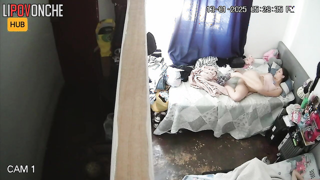 Sexy brunette taking photo of her wet pussy on the bed