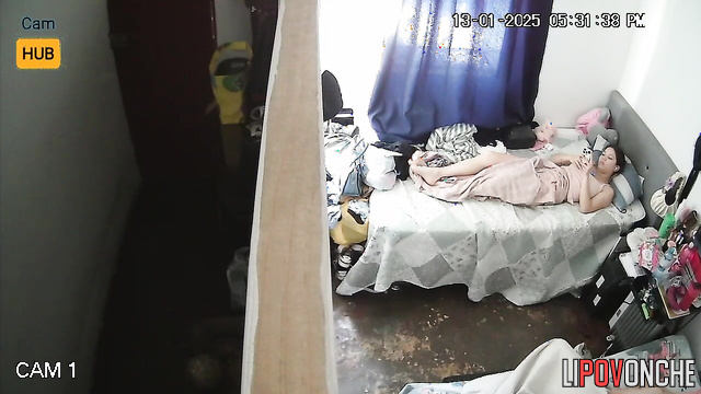 Sexy brunette taking photo of her wet pussy on the bed