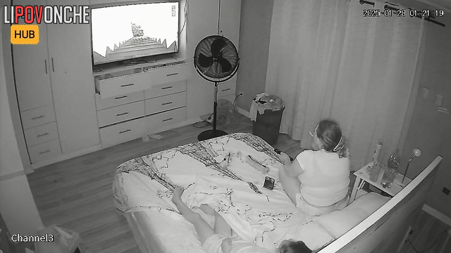 Chubby blonde smoking during tv watching (beside her relative)