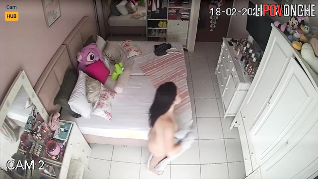 Hidden camera from sister's bedroom: Bolivian girl changes clothes after bath.