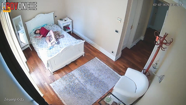 Hidden camera filmed a Turkish girl hotly masturbating while lying on her side.