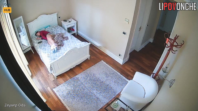 Hidden camera filmed a Turkish girl hotly masturbating while lying on her side.