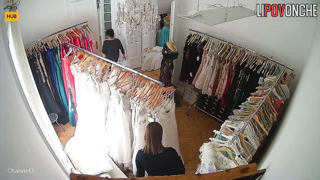 A big-breasted Serbian bride tries on her wedding gown