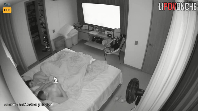 Colombian beauty plays under the covers with her bored husband's cock