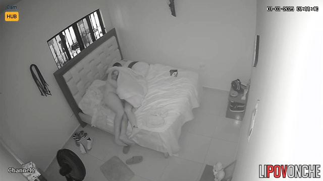 Excited tattooed husband kisses his wife's back, playing with her butt
