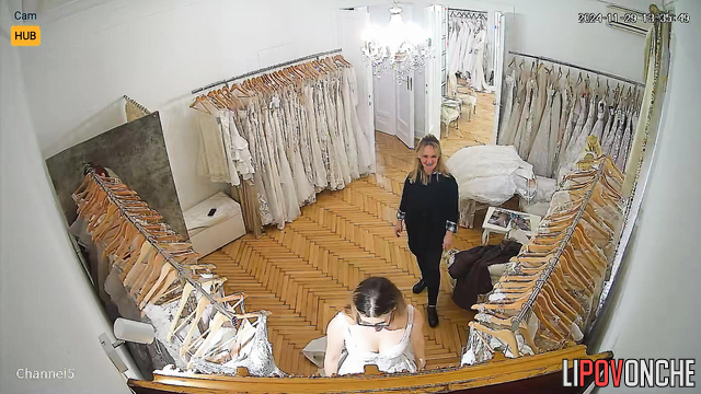 Bride picks dress for her wedding and you can see her boobs