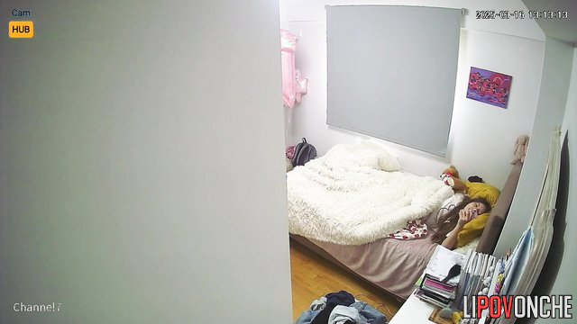 A young beauty with a voluptuous, seductive butt watches porn in her bed