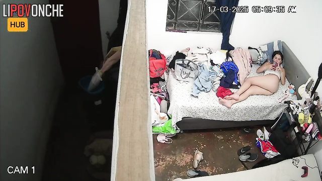 A bored teenage girl plays with her anus with her finger, filming it on her phone