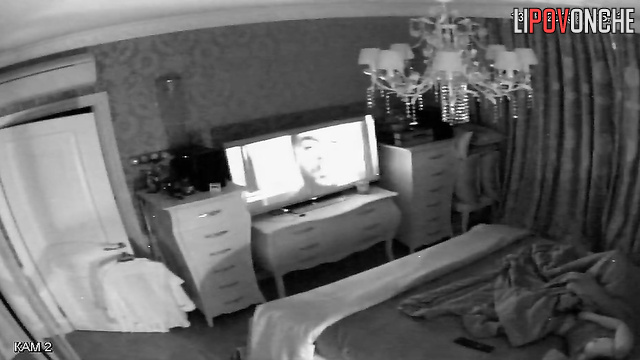 A naked beauty brings herself to an intense orgasm while watching TV
