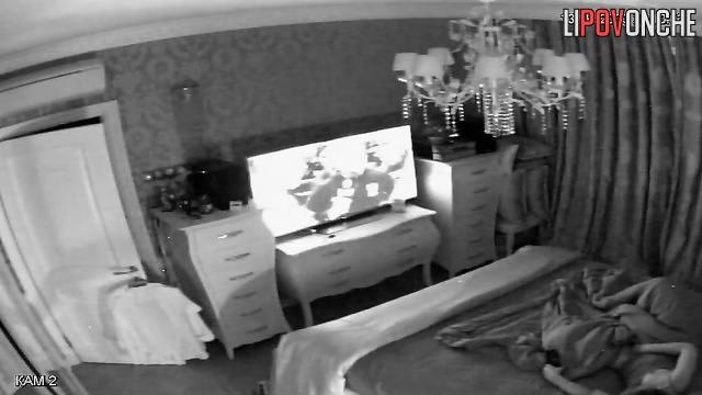 A naked beauty brings herself to an intense orgasm while watching TV