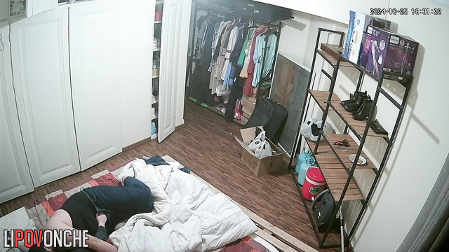 A fat, bearded man is having sex with a brunette in an unusual position