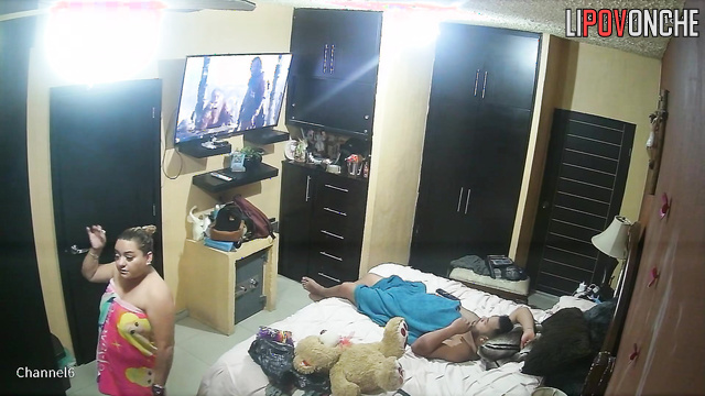 A short, chubby wife climbs on top of her naked husband to have sex