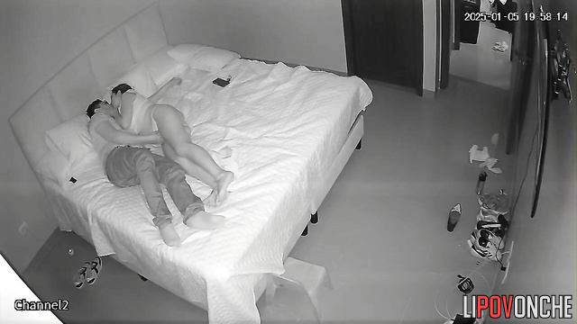 The brunette presses her hairy pussy tightly against the man in the cowgirl position