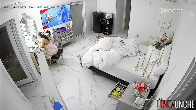 A hidden camera captured the naked breasts and big butt of a fat brunette