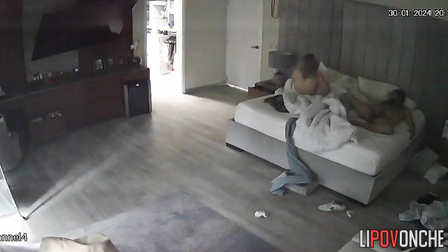 The aroused woman sits down on her sleeping husband's erect dick