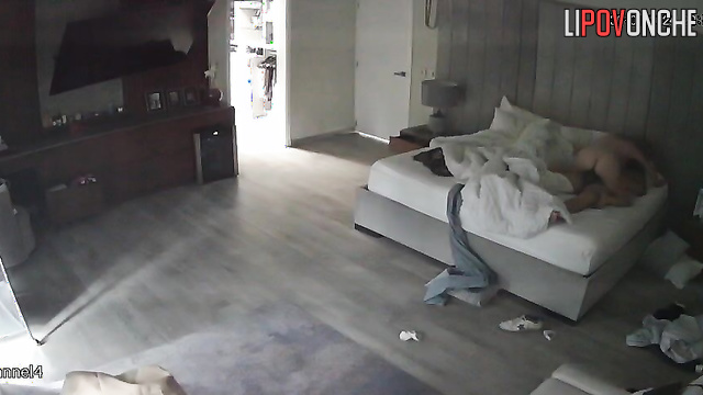 The aroused woman sits down on her sleeping husband's erect dick