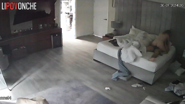 The aroused woman sits down on her sleeping husband's erect dick