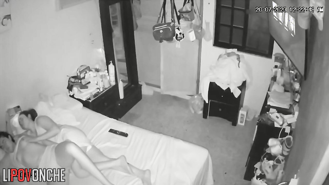 Lesbian girls teasing each other in bed during tv watching