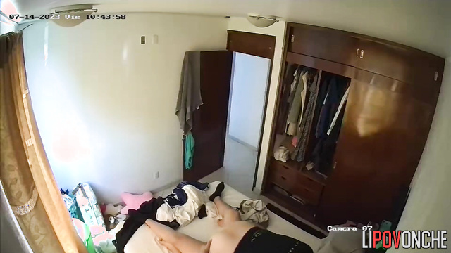 The wife is insistently pulling her husband's underwear down, wanting to have sex