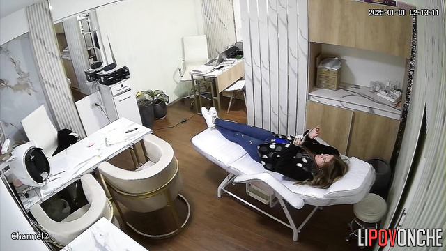 A male doctor fondles his attractive patient's breasts on a daybed