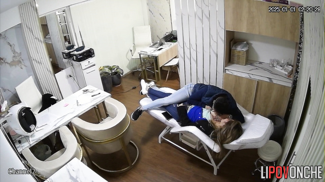 A male doctor fondles his attractive patient's breasts on a daybed