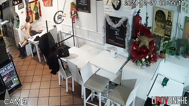 Lovers kissing and fucking in the closed italian cafe
