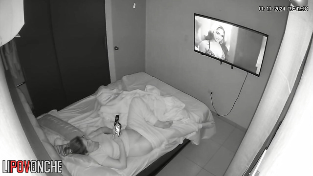 Sexy lady puts on her favorite porn scene and plays with her pussy