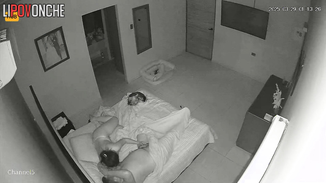 Couple lying on the bed and teasing each other after work