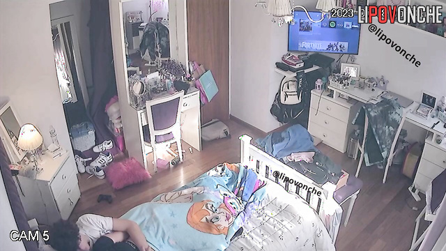 Teens enjoying something interesting under the blanket