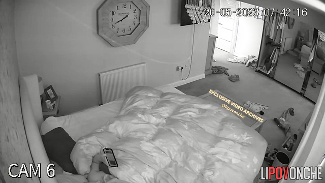 A waking husband reaches for his wife's seductive naked breast