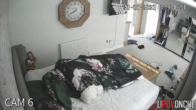 A waking husband reaches for his wife's seductive naked breast