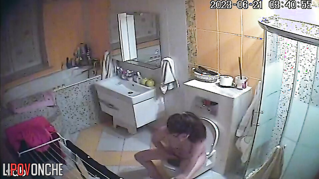 Young naked mom with tender tits plays with her pussy after peeing