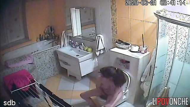 Young naked mom with tender tits plays with her pussy after peeing