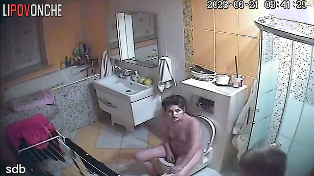 Young naked mom with tender tits plays with her pussy after peeing