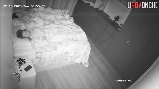 Husband is sleeping and doesn't know what she's doing under the blanket