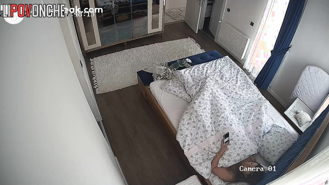Brunette relaxing alone in the bed before sound sleep