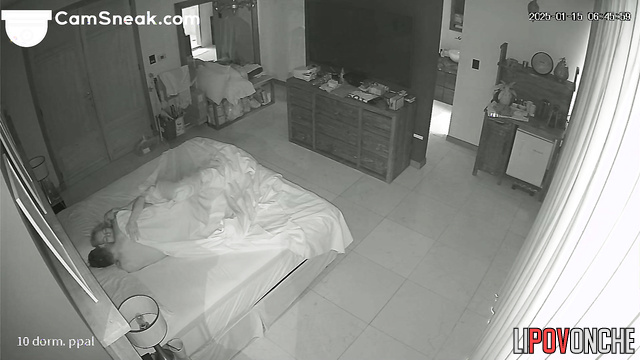 A sexually aroused husband wakes up his sleepy wife by playing with her pussy