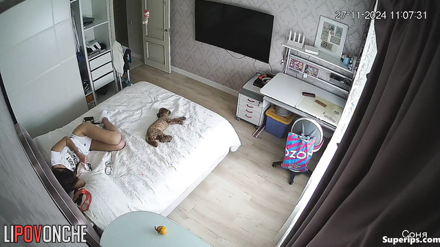 Teen chilling on the bed and watching TV, solo tape
