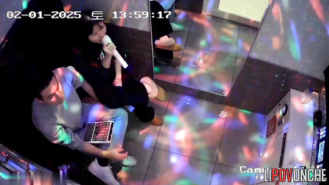 Asian teen making blowjob at karaoke club (to her classmate)