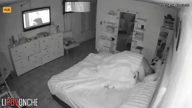 Missionary sex in bed under the nightly news broadcast