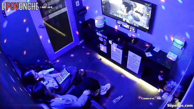 Asian best friends singing in a cool karaoke club, hidden video