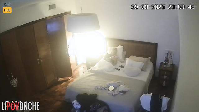Blonde chatting with her friends lying on the bed