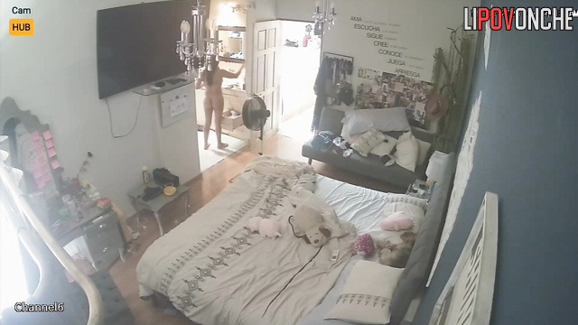 Slim girl drying her brown hair right now, hidden camera