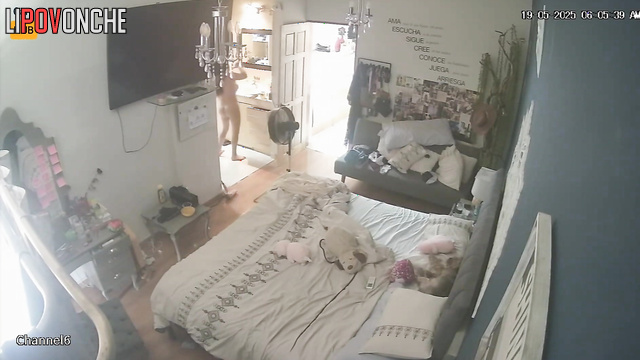 Slim girl drying her brown hair right now, hidden camera