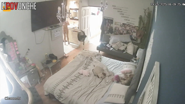 Slim girl drying her brown hair right now, hidden camera