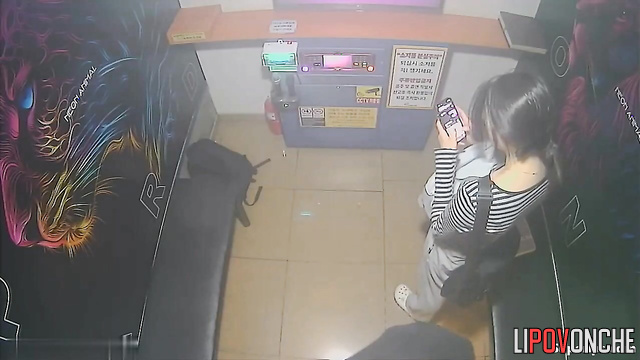 Young asian couple making dirty things in the karaoke club