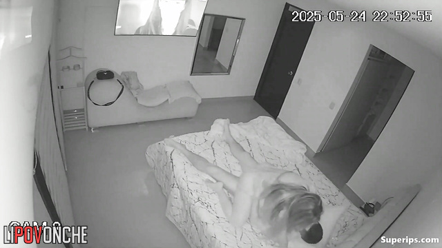 Couple kissing and enjoying each other under the blanket