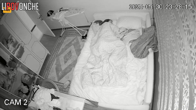 Lonely woman jumping under the blanket in the night